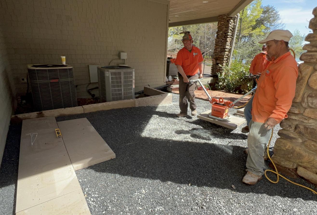 Toms Creek crew compacting the base before setting pavers